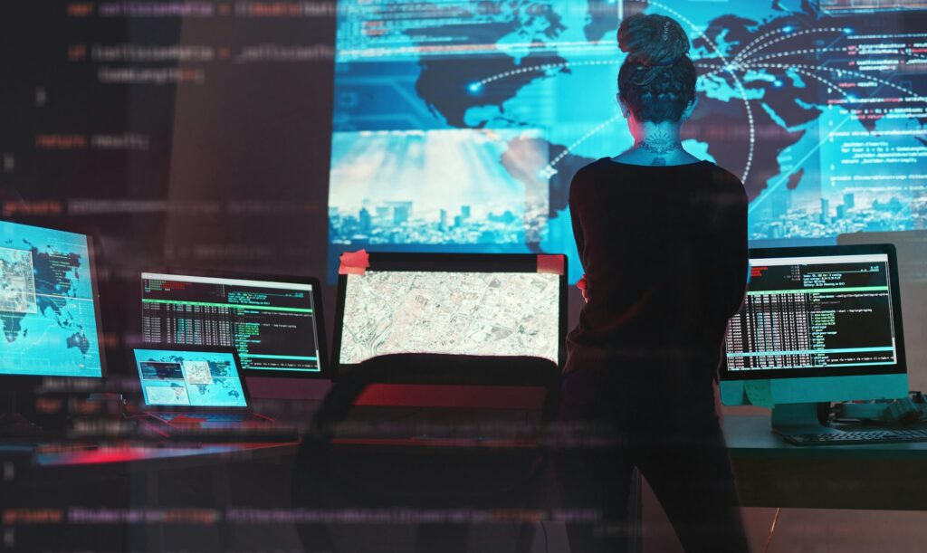 Cybersecurity, woman hacker and global network code for phishing, ransomware and cyber terrorism se