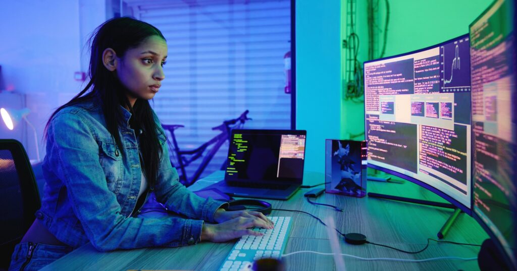 Serious developer, code and computer screen in neon programming, cybersecurity analytics or SEO nig